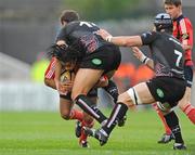 15 May 2009; Lifeimi Mafi, Munster, is tackled by Ashley Beck and Marty Holah, 7, Ospreys. Magners League, Munster v Neath Swansea Ospreys, Thomond Park, Limerick. Picture credit: Pat Murphy / SPORTSFILE