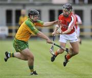 17 May 2009; Paul Breen, Armagh, in action against Conor McLoughlin, Donegal. Ulster Senior Hurling Championship, Second Round, Donegal v Armagh, Letterkenny, Co. Donegal. Picture credit: Oliver McVeigh / SPORTSFILE