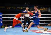 10 October 2015; Joahnys Argilagos, left, Cuba, exchanges punches with Brendan Irvine, Ireland, during their Men's Light Flyweight 46-49kg Quarter-Final bout. AIBA World Boxing Championships, Quarter-Finals, Ali Bin Hamad Al Attiyah Arena, Doha, Qatar. Photo by Sportsfile
