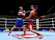 11 October 2015; Michael O'Reilly, left, Ireland, exchanges punches with Bektemir Melikuziev, Uzbekistan, during their Men's Middleweight 75kg Quarter-Final bout. AIBA World Boxing Championships, Semi-Finals, Ali Bin Hamad Al Attiyah Arena, Doha, Qatar. Photo by Sportsfile