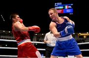 11 October 2015; Michael O'Reilly, right, Ireland, exchanges punches with Bektemir Melikuziev, Uzbekistan, during their Men's Middleweight 75kg Quarter-Final bout. AIBA World Boxing Championships, Semi-Finals, Ali Bin Hamad Al Attiyah Arena, Doha, Qatar. Photo by Sportsfile