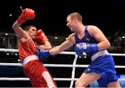 11 October 2015; Michael O'Reilly, right, Ireland, exchanges punches with Bektemir Melikuziev, Uzbekistan, during their Men's Middleweight 75kg Quarter-Final bout. AIBA World Boxing Championships, Semi-Finals, Ali Bin Hamad Al Attiyah Arena, Doha, Qatar. Photo by Sportsfile