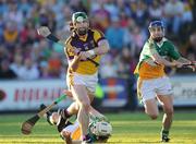 30 May 2009; Stephen Banville, Wexford, on his way to scoring his side's second goal after he was tackled by David Kenny, left, and David Franks, Offaly. Leinster GAA Hurling Senior Championship First Round, Wexford v Offaly, Wexford Park, Wexford. Picture credit: Matt Browne / SPORTSFILE