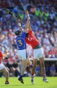 31 May 2009; Aisake O hAilpin, Cork, and Paul Curran, Tipperary, contest a dropping ball. Munster GAA Hurling Senior Championship Quarter-Final, Tipperary v Cork, Semple Stadium, Thurles, Co. Tipperary. Picture credit: Brendan Moran / SPORTSFILE