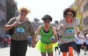 1 June 2009; Steven Neil, left, Melvin Mooney and Ivor Hayes, right, all from Cloughjordan, North Tipperary, warm up before the start of the race. Flora Dublin Women's Mini-Marathon, Dublin. Photo by Sportsfile