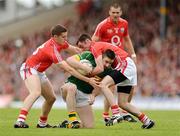 7 June 2009; Darragh O Se, Kerry, in action against Daniel Goulding, left, and Donncha O'Connor, Cork. Munster GAA Football Senior Championship Semi-Final, Kerry v Cork, Fitzgerald Stadium, Killarney, Co. Kerry. Picture credit: Stephen McCarthy / SPORTSFILE