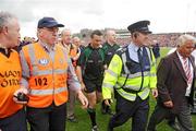 7 June 2009; Referee Maurice Deegan, is escorted of the pitch after the match. Munster GAA Football Senior Championship Semi-Final, Kerry v Cork, Fitzgerald Stadium, Killarney, Co. Kerry. Picture credit: Stephen McCarthy / SPORTSFILE