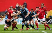 17 October 2015; Shane Monahan, Munster, is tackled by James Down, Josh Turnbull and Dan Fish, Cardiff Blues. Guinness PRO12, Round 4, Munster v Cardiff Blues. Irish Independent Park, Cork. Picture credit: Diarmuid Greene / SPORTSFILE