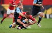 17 October 2015; CJ Stander, Munster, is tackled by Dan Fish, Cardiff Blues. Guinness PRO12, Round 4, Munster v Cardiff Blues. Irish Independent Park, Cork. Picture credit: Diarmuid Greene / SPORTSFILE