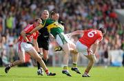 13 June 2009; Tomas O Se, Kerry, loses possession after a shoulder from Graham Canty, 6, Cork. GAA Football Munster Senior Championship Semi-Final Replay, Cork v Kerry, Pairc Ui Chaoimh, Cork. Picture credit: Brendan Moran / SPORTSFILE