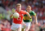 13 June 2009; Anthony Lynch, Cork, in action against Colm Cooper, Kerry. GAA Football Munster Senior Championship Semi-Final Replay, Cork v Kerry, Pairc Ui Chaoimh, Cork. Picture credit: Brendan Moran / SPORTSFILE