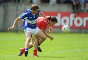 14 June 2009; Pat Ryan, Louth, in action against Michael John Tierney, Laois. GAA Football Leinster Senior Championship Quarter-Final, Laois v Louth, Parnell Park, Dublin. Picture credit: Ray McManus / SPORTSFILE *** Local Caption ***