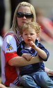 14 June 2009; Twenty-month-old Mia Toner, wearing a Dublin jersey, and her mother Debbie, from Dundalk, supporting Louth at the game. GAA Football Leinster Senior Championship Quarter-Final, Laois v Louth, Parnell Park, Dublin. Picture credit: Ray McManus / SPORTSFILE