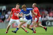 14 June 2009; Ger Reddin, Laois, in action against Ronan Carroll, left, and Ray Finnegan, Louth. GAA Football Leinster Senior Championship Quarter-Final, Laois v Louth, Parnell Park, Dublin. Picture credit: Ray McManus / SPORTSFILE