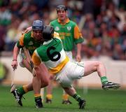 24 May1998. Meath's Fergus McMahon is tackled by Offaly's Brian Whelahan. Meath v Offaly, Leinster Hurling Championship, Croke Park. Picture Credit Ray McManus/SPORTSFILE