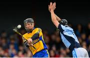 25 October 2015; Niall Gilligan, Sixmilebridge, scores a point despite the efforts of Cathal King, Na Piarsaigh. AIB Munster GAA Senior Club Hurling Championship, Sixmilebridge v Na Piarsaigh. O'Garney Park, Sixmilebridge, Co. Clare. Picture credit: Piaras Ó Mídheach / SPORTSFILE