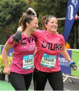 26 October 2015; Eva and Laura Caulwell from Dublin, on their way to finish the SSE Airtricity Dublin Marathon 2015, Merrion Square, Dublin. Picture credit: Tomas Greally / SPORTSFILE