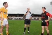 28 June 2009; Referee Brian Gavin tosses the coin as Antrim captain Neil McGarry, left, and Down captain Graham Clarke look on. GAA Hurling Ulster Senior Championship Final, Antrim v Down, Casement Park, Belfast, Co. Antrim. Picture credit: Oliver McVeigh / SPORTSFILE