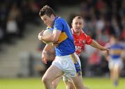 4 July 2009; Barry Grogan, Tipperary, in action against Raymond Finnegan, Louth. GAA Football All-Ireland Senior Championship Qualifier, Round 1, Louth v Tipperary, Gaelic Grounds, Drogheda, Co. Louth. Photo by Sportsfile