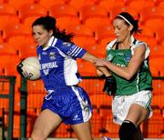 4 July 2009; Grainne Smith, Cavan, in action against Tara Hughes, Fermanagh. TG4 Ladies Football Ulster Intermediate Championship Final, Cavan v Fermanagh, Athletic Grounds, Armagh. Picture credit: Michael Cullen / SPORTSFILE