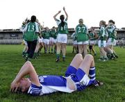 4 July 2009; A dejected Elish Cornyn, Cavan, as Fermanagh players celebrate. TG4 Ladies Football Ulster Intermediate Championship Final, Cavan v Fermanagh, Athletic Grounds, Armagh. Picture credit: Michael Cullen / SPORTSFILE