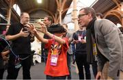 3 November 2015; James Heavey, age 11, from Dalkey, Co. Dublin, with Jochen Penne from pmdtechnologies gmbh, during Day 1 of the 2015 Web Summit in the RDS, Dublin, Ireland. Photo by Sportsfile / Web Summit