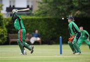 9 July 2009; Ireland wicket-keeper Gary Wilson reacts before being struck in the face by the ball as Kenya's Nehemiah Odhiambo looks on. One Day International, Ireland v Kenya, Clontarf, Dublin. Picture credit: Brian Lawless / SPORTSFILE