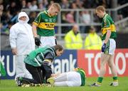 11 July 2009; Kerry's Kieran Donaghy is attended to by team physio John Sugrue before leaving the pitch with a foot injury. GAA Football All-Ireland Senior Championship Qualifier, Round 2, Longford v Kerry, Pearse Park, Longford. Picture credit: Brendan Moran / SPORTSFILE