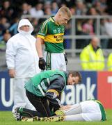 11 July 2009; Kerry's Kieran Donaghy is attended to by team physio John Sugrue before leaving the pitch with a foot injury. GAA Football All-Ireland Senior Championship Qualifier, Round 2, Longford v Kerry, Pearse Park, Longford. Picture credit: Brendan Moran / SPORTSFILE