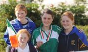 13 July 2009; Ireland's Ciara Mageean with her brother Brendan, sisters Nuala, left, and Maire, and the silver medal she won in the Women's 800 metres final in the IAAF World Youth Championships in Italy on her arrival home at Dublin Airport. Dublin Airport, Dublin. Picture credit: Brendan Moran / SPORTSFILE