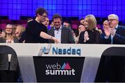 4 November 2015; Paddy Cosgrave, CEO, Web Summit, rings the NASDAQ Closing Bell, in the company of Adam Kostyál, Senior Vice President of Listing Services, Europe, NASDAQ, an Claire Byrne, Presenter, RTE, during Day 2 of the 2015 Web Summit in the RDS, Dublin, Ireland. Picture credit: Stephen McCarthy / SPORTSFILE / Web Summit