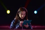 5 November 2015; An early arrival uses her phone ahead of the opening talk on the Marketing Stage during Day 3 of the 2015 Web Summit in the RDS, Dublin, Ireland. Picture credit: Sam Barnes / SPORTSFILE / Web Summit