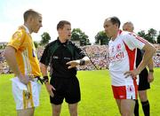 19 July 2009; Brian Dooher, Tyrone, and Paddy Cunningham, Antrim at the toss with referee Padraig Hughes, Armagh. GAA Football Ulster Senior Championship Final, Tyrone v Antrim, St Tighearnach's Park, Clones, Co. Monaghan. Picture credit: Michael Cullen / SPORTSFILE