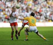 19 July 2009; Brian Dooher, Tyrone, in action against Michael McCann, Antrim. GAA Football Ulster Senior Championship Final, Tyrone v Antrim, St Tighearnach's Park, Clones, Co. Monaghan. Picture credit: Oliver McVeigh / SPORTSFILE