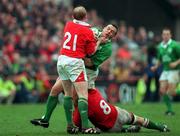 1 April 2000; Rob Henderson if Ireland is tackled by Neil Jenkins, left, and Geraint Lewis of Wales during the Lloyds TSB 6 Nations match between Ireland and Wales at Lansdowne Road in Dublin. Photo by Brendan Moran/Sportsfile