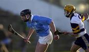 26 November 2000; Eddie Brennan of Graigue-Ballycallan, is tackled by Brian Walton of UCD during the AIB Leinster Senior Hurling Championship Final between Graigue-Ballycallan and University College Dublin at Nowlan Park in Kilkenny. Photo by Ray McManus/Sportsfile