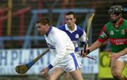 4 November 2000; John Lyons of Castletown runs clear of Gary Hanniffy of Birr during the AIB Leinster Club Hurling Championship Quarter-Final match between Castletown and Birr at O'Moore Park in Portlaoise, Laois. Photo by Ray McManus/Sportsfile