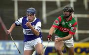 4 November 2000; Robert Delaney of Castletown in action against Gary Hanniffy of Birr during the AIB Leinster Club Hurling Championship Quarter-Final match between Castletown and Birr at O'Moore Park in Portlaoise, Laois. Photo by Ray McManus/Sportsfile