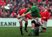 1 April 2000; Brian O'Driscoll of Ireland passes out of a tackle during the Lloyds TSB 6 Nations match between Ireland and Wales at Lansdowne Road in Dublin. Photo by Matt Browne/Sportsfile