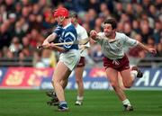 17 March 2000; Joe Considine of St Joseph's Doorabarefield in action against Pat Higgins of St Mary's Athenry during the AIB All-Ireland Senior Club Hurling Championship Final match between Athenry and St Joseph's Doorabarefield at Croke Park in Dublin. Photo by Ray McManus/Sportsfile