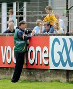 26 July 2009; Kerry manager Jack O'Connor signs an autograph for a young Antrim fan before the game. GAA All-Ireland Senior Football Championship Qualifier Round 4, Antrim v Kerry, O'Connor Park, Tullamore, Co. Offaly. Picture credit: Brendan Moran / SPORTSFILE