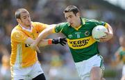 26 July 2009; Declan O'Sullivan, Kerry, in action against Colin Brady, Antrim. GAA All-Ireland Senior Football Championship Qualifier Round 4, Antrim v Kerry, O'Connor Park, Tullamore, Co. Offaly. Picture credit: Brendan Moran / SPORTSFILE