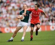 2 August 2009; James Kavanagh, Kildare, in action against Philip Jordan, Tyrone. GAA Football All-Ireland Senior Championship Quarter-Final, Tyrone v Kildare, Croke Park, Dublin. Picture credit: Ray McManus / SPORTSFILE