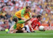 2 August 2009; Donncha O'Connor, Cork, in action against Barry Dunnion, 5, and Neil McGee, Donegal. GAA Football All-Ireland Senior Championship Quarter-Final, Cork v Donegal, Croke Park, Dublin. Picture credit: Daire Brennan / SPORTSFILE