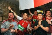 6 August 2009; St Patrick's Athletic supporters celebrate in McDowells pub, in Inchicore, after their side progressed to the play-off stage of the Europa League after an away-goals victory over Krylya Sovetov. McDowelles Pub, Inchicore, Dublin. Picture credit: Ray McManus / SPORTSFILE