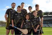 18 Novemeber 2015; Dublin footballer Jack McCaffrey and Kilkenny hurler TJ Reid pictured with Gillian Whittall, Marketing and PR manager Opel Ireland, and children, from left, Jack Byrne, aged 11, from Strokestown, Roscommon, Kyle Casey, aged 12, from Roscommon, Ella O'Keeffe, aged, 8, from Burtis, Dublin and  James Black, aged 8, from Enfield Co Meath, at the launch of the 2015 Opel GAA/GPA All-Stars jersey in support of the Childhood Cancer Foundation. The jersey will carry the CCF (Childhood Cancer Foundation) ribbon logo on the sleeve, while a percentage of all jersey sales will be donated to the Foundation by Opel and jersey manufacturers O’Neills. Croke Park, Dublin. Picture credit: Piaras Ó Mídheach / SPORTSFILE