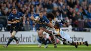 15 November 2015; Ian Madigan, Leinster, eacapes the tackle of Simon McIntyre, and Ashley Johnson, Wasps. European Rugby Champions Cup, Pool 5, Round 1, Leinster v Wasps. RDS, Ballsbridge, Dublin. Picture credit: Brendan Moran / SPORTSFILE