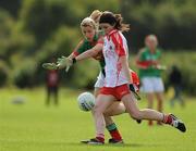 15 August 2009; Maura Kelly, Tyrone, in action against Cora Staunton, Mayo. TG4 All-Ireland Ladies Football Senior Championship Quarter-Final, Tyrone v Mayo, Ballymahon GAA Club, Ballymahon, Co. Longford. Photo by Sportsfile