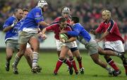 20 January 2001; Dominic Crotty of Munster is tackled by  Frederic Seguier of Castres during the Heineken Cup Pool 4 Round 6 match between Munster and Castres at Musgrave Park in Cork. Photo by Brendan Moran/Sportsfile