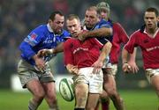 20 January 2001; Peter Stringer of Munster is tackled by Jose Diaz, left, and Philippe Garrigues of Castres during the Heineken Cup Pool 4 Round 6 match between Munster and Castres at Musgrave Park in Cork. Photo by Brendan Moran/Sportsfile